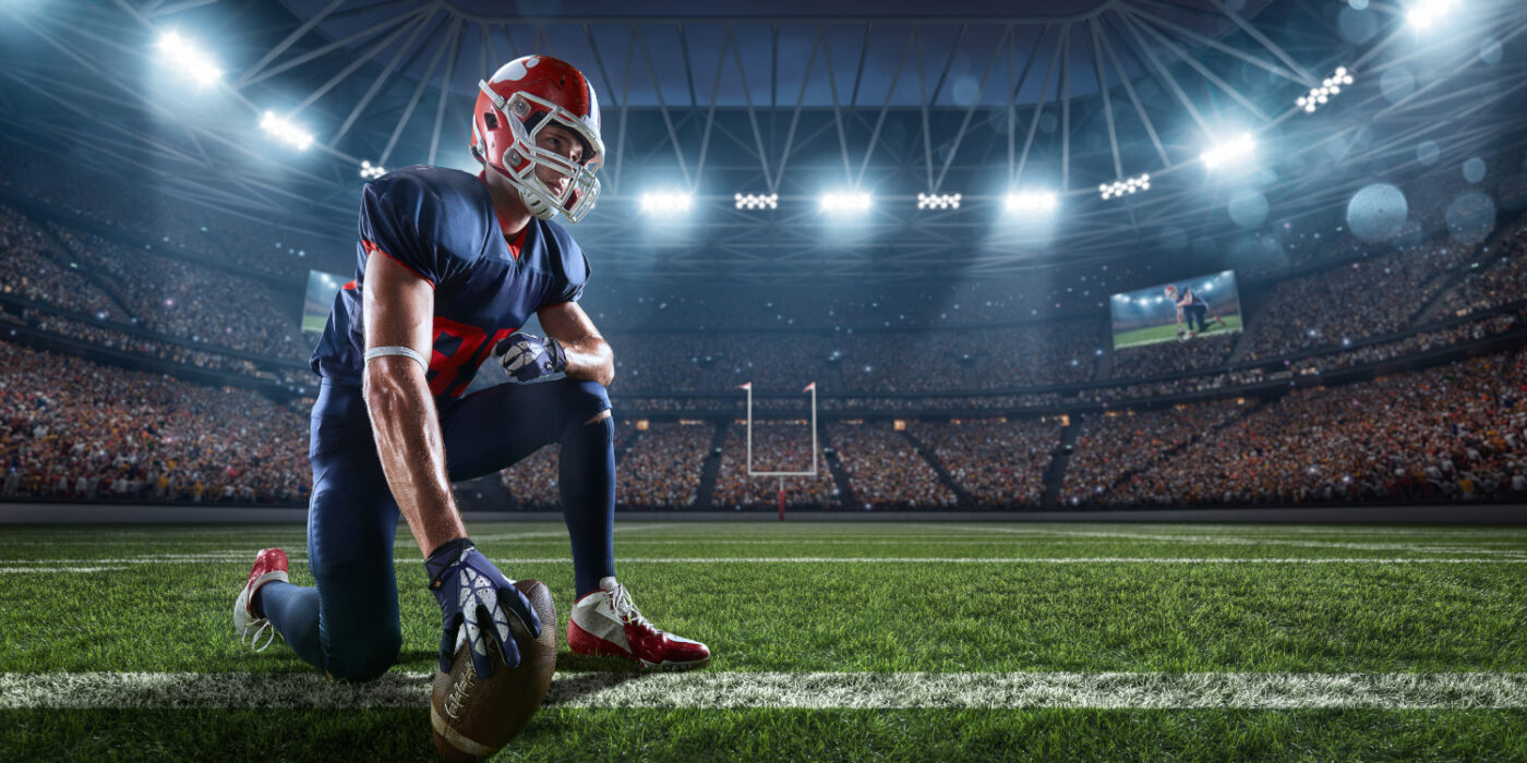 american football player in a well-lited stadium