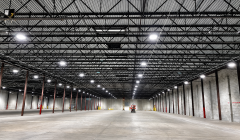 Warehouse lighting layout with LED high bay fixtures installed above storage aisles